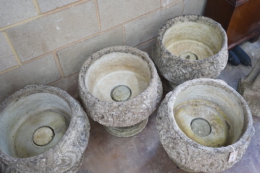 A matched set of four circular reconstituted stone garden planters, moulded with acanthus scrolls, diameter 44cm, height 47cm